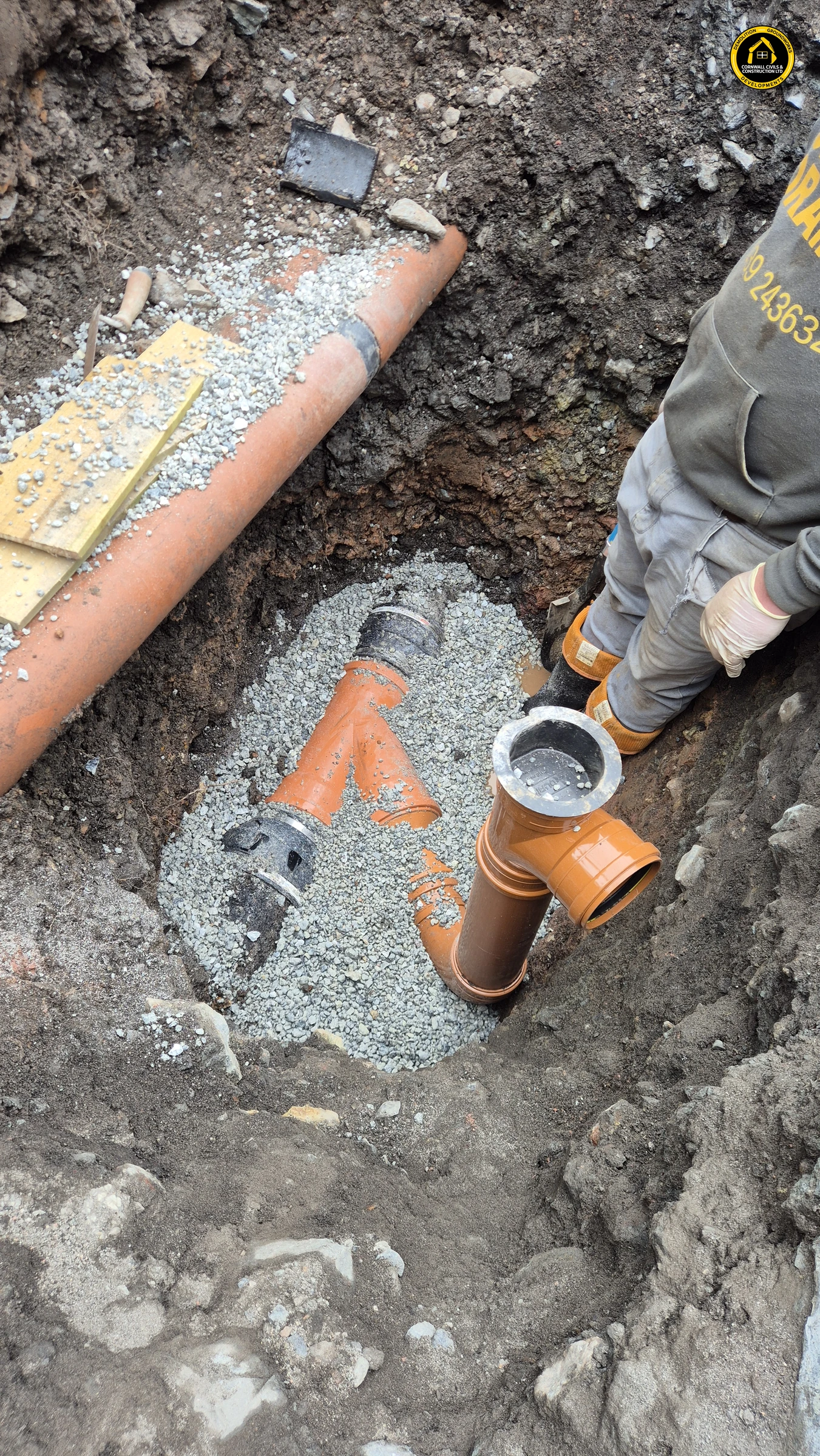 New drainage junction being connected in an open trench in St Agnes